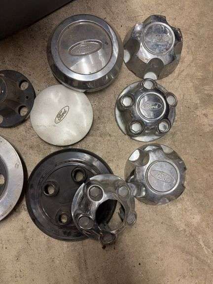 Tote of Ford hub caps and parts