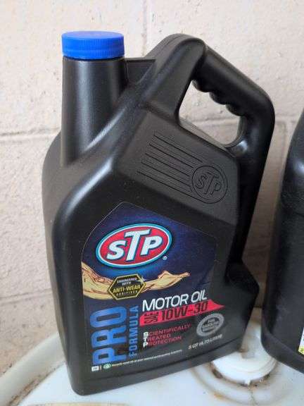 Assortment of motor oil and other vehicle fluids - most partially full