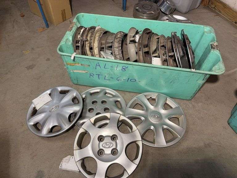 Large tote of hub caps and parts -Hyundai, Eagle and more