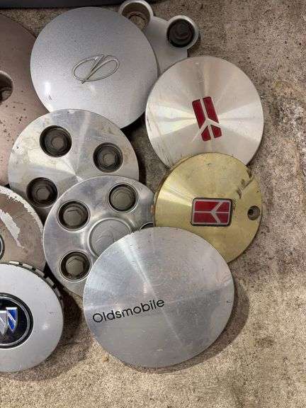 Tote of Oldsmobile hub caps and covers