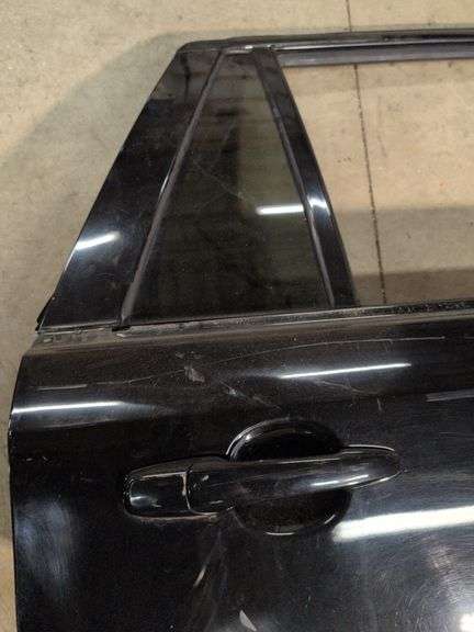 Unmarked black vehicle door - see photos