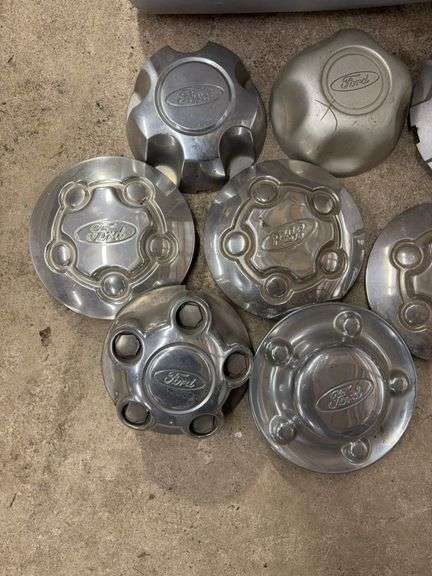 Tote of Ford hub caps and parts