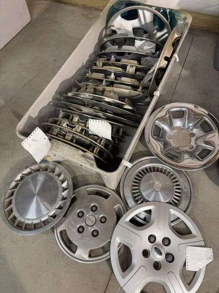 Large tote of hub caps and parts -Pontiac, Chrysler and more