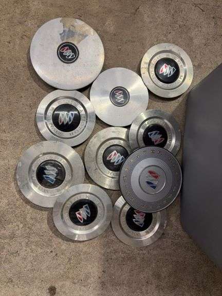 Tote of Buick hub caps and parts
