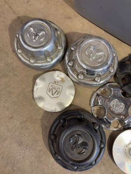 Large tote of hub caps and parts - Mostly Ram -see photos