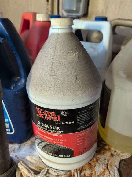 Assortment of motor oil and other vehicle fluids - most partially full