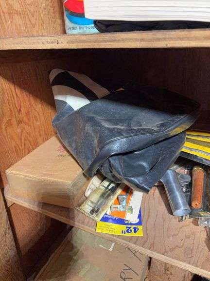 Contents of cabinet - oil filters, wiper blades, CB radios, manuals, and more