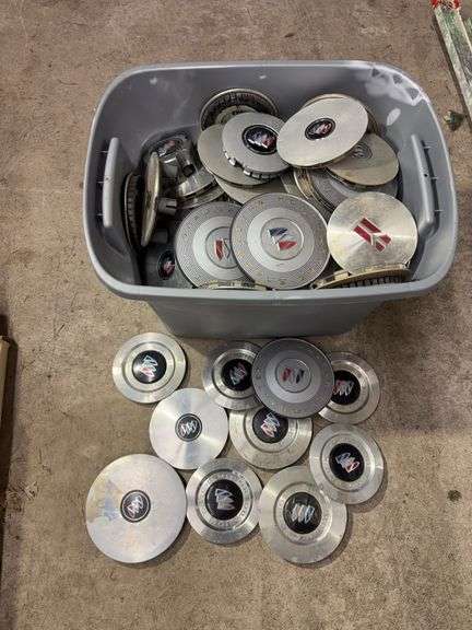 Tote of Buick hub caps and parts
