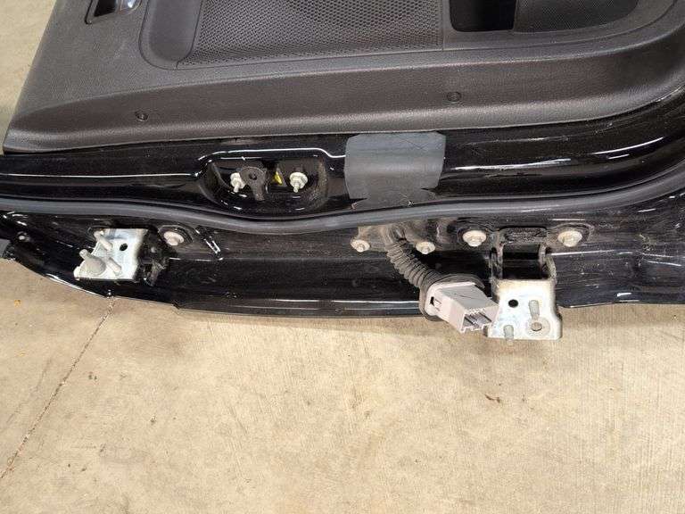 Unmarked black vehicle door - see photos