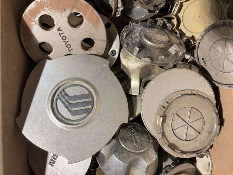 Large tote of miscellaneous hub caps and parts -Volvo, Nissan, Honda, BMW and more
