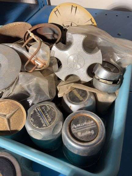 Tote of hub caps and parts, Jeep, Nissan, Toyota and more