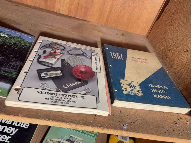 Contents of cabinet - oil filters, wiper blades, CB radios, manuals, and more