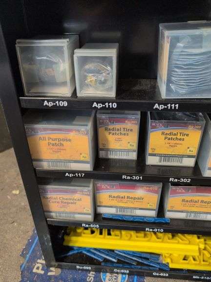 Metal tire repair cabinet with contents