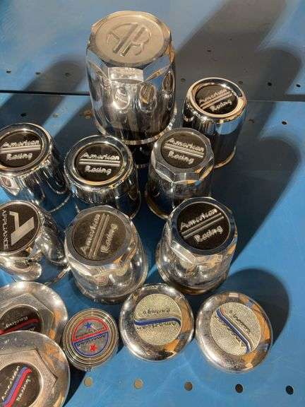 Box of American racing hubcap covers