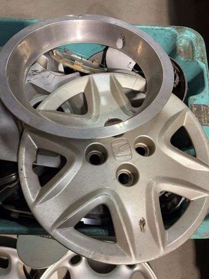 Large tote of hub caps and parts -Honda, Mazda, Nissan and more