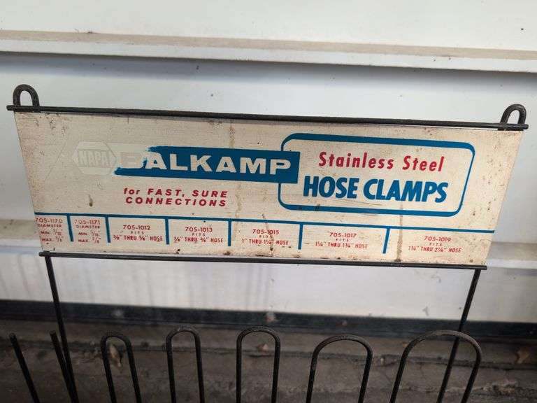 NAPA metal rack with hose clamps