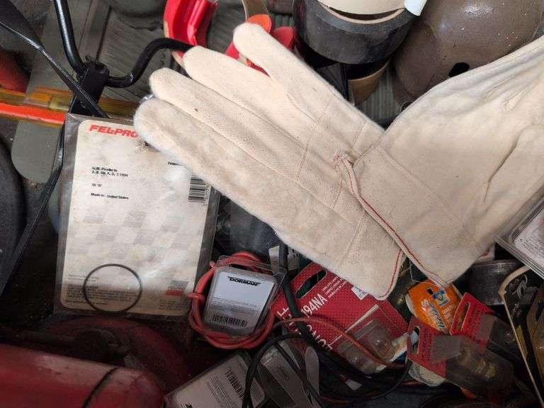 Assortment of items - tape, nuts and bolts, gloves, and more