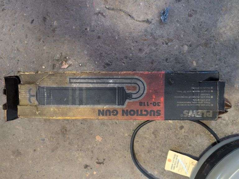 Work light on extension reel and suction gun