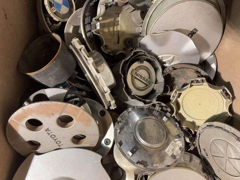 Large tote of miscellaneous hub caps and parts -Volvo, Nissan, Honda, BMW and more