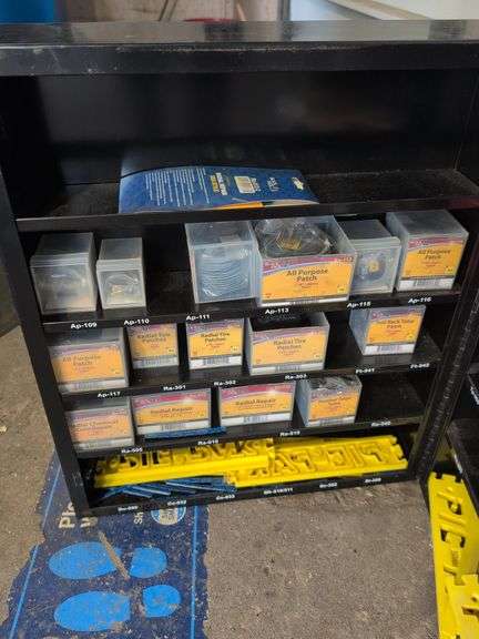 Metal tire repair cabinet with contents