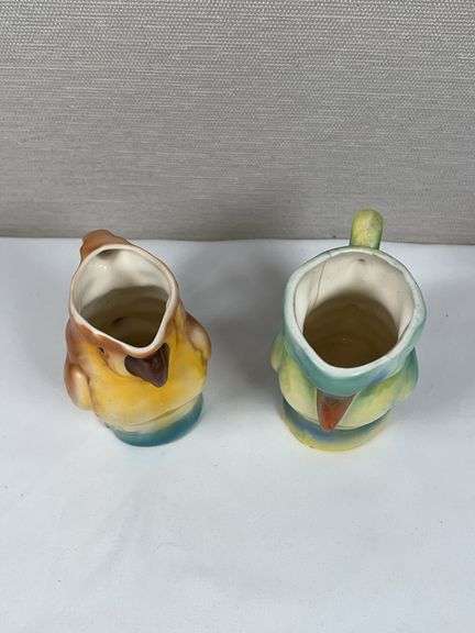 PAIR OF UNUSUAL POTTERY MUGS