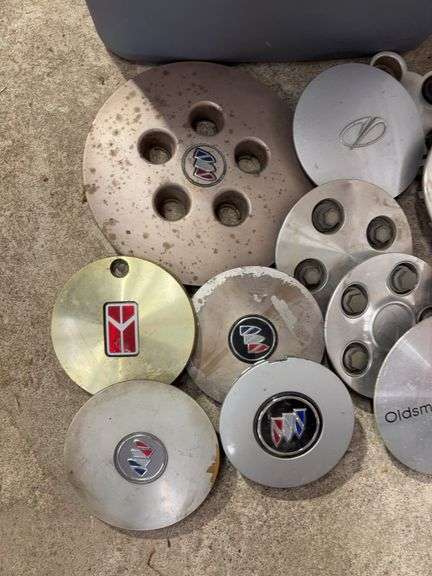 Tote of Oldsmobile hub caps and covers