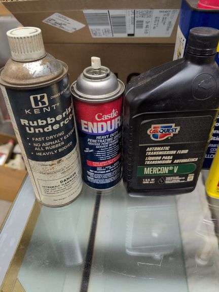 Flat of WD-40, oil, and other mechanic fluids