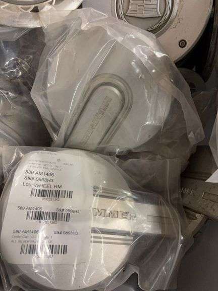 Tote of hub caps and parts -Ford, Oldsmobile and more