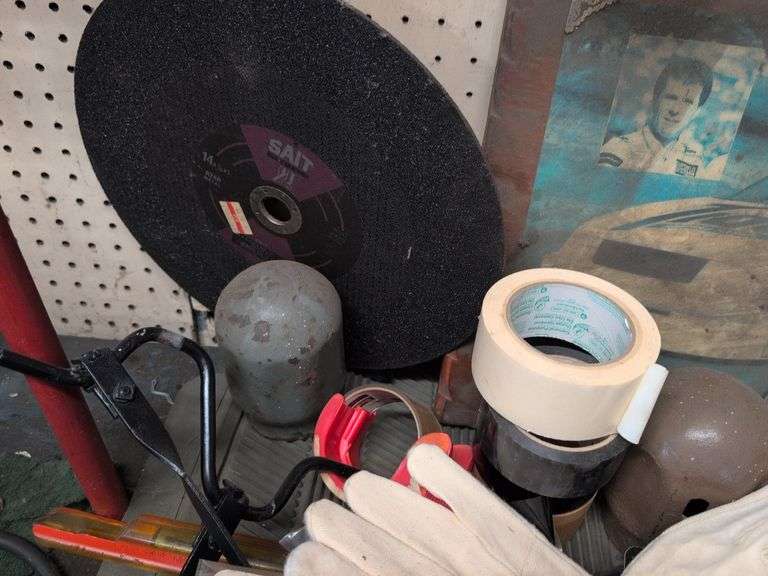 Assortment of items - tape, nuts and bolts, gloves, and more