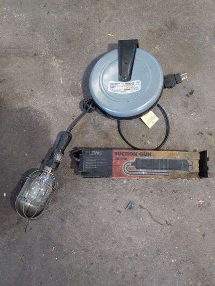 Work light on extension reel and suction gun