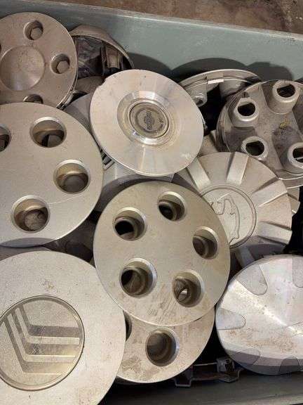 Large lot of miscellaneous hub caps and parts, paste wax and more