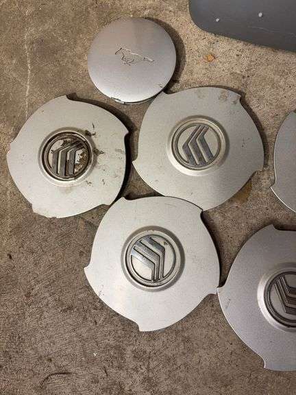 Tote of Miscellaneous hub caps and parts -see photos