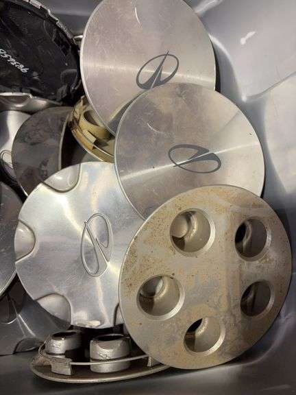 Tote of Miscellaneous hub caps and parts - Buick, Oldsmobile and more - see photos