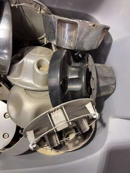 Tote of Ford hub caps and parts