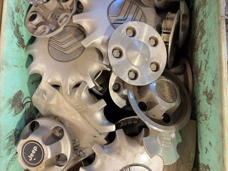Large tote of miscellaneous hub caps and parts -Jeep, Lincoln, Ford and more