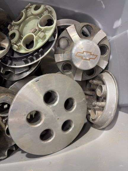 Tote of miscellaneous hub caps and parts -Limited, Chevy and more -see photos