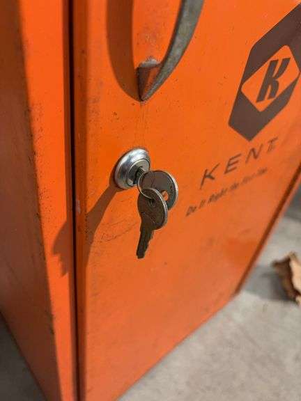 Orange metal storage cabinet marked Kent with keys - 14" x 13" x 30"