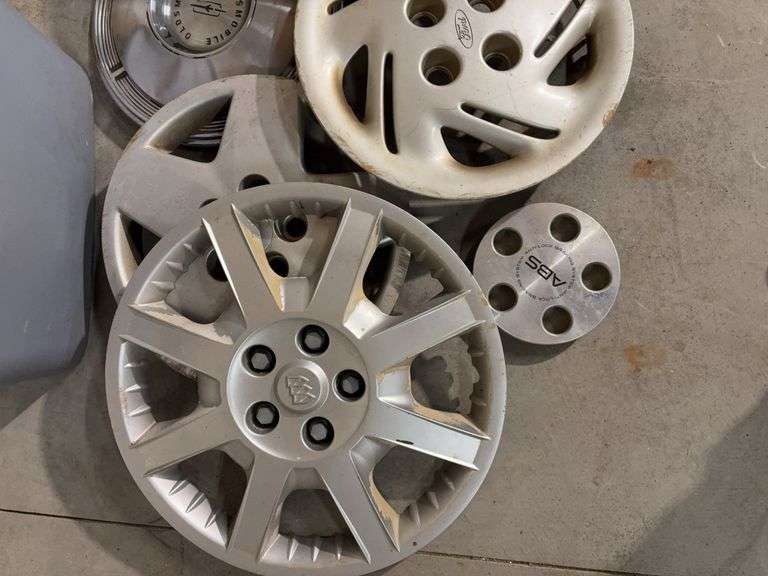 Tote of hub caps and parts -Ford, Oldsmobile and more