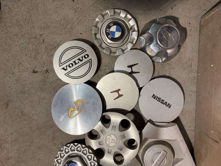 Large tote of miscellaneous hub caps and parts -Volvo, Nissan, Honda, BMW and more