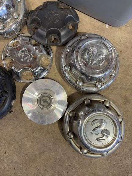 Large tote of hub caps and parts - Mostly Ram -see photos