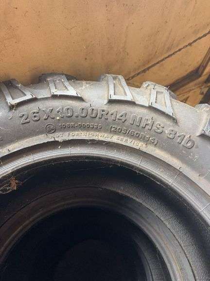 (4) tires like new - 26/10.00/14 - see photos