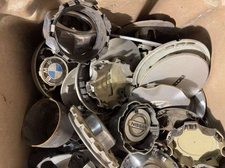 Large tote of miscellaneous hub caps and parts -Volvo, Nissan, Honda, BMW and more