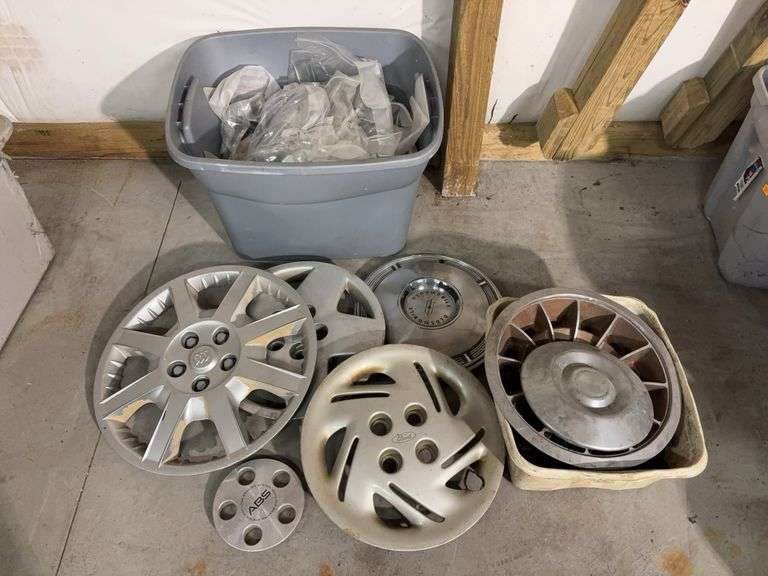 Tote of hub caps and parts -Ford, Oldsmobile and more