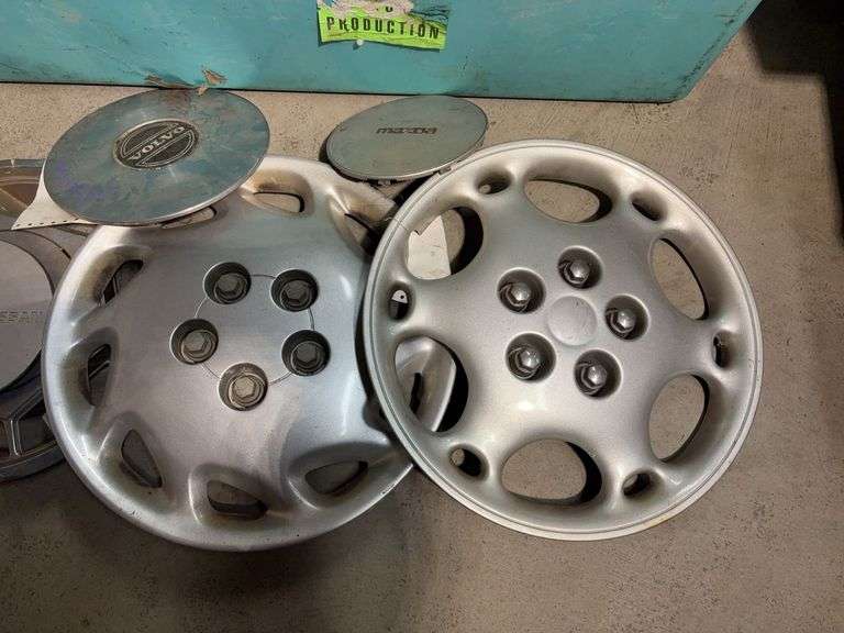 Large tote of hub caps and parts -Honda, Mazda, Nissan and more