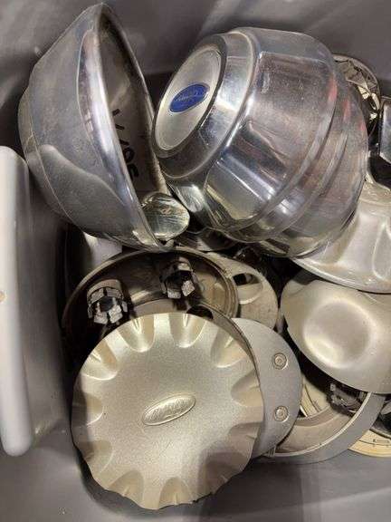Tote of Ford hub caps and parts