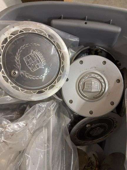 Tote of hub caps and parts -Ford, Oldsmobile and more