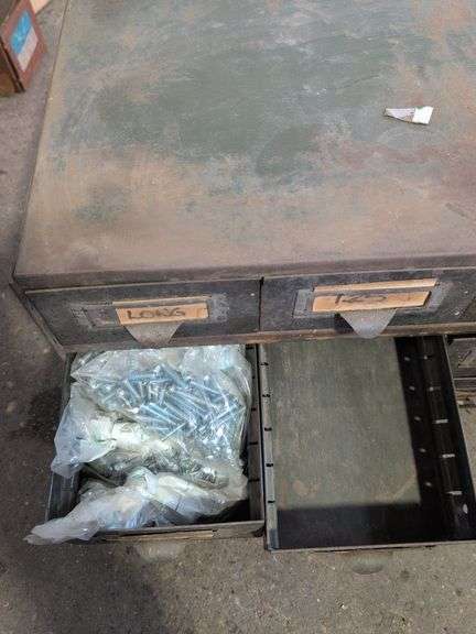 Metal hardware cabinet with nuts and bolts