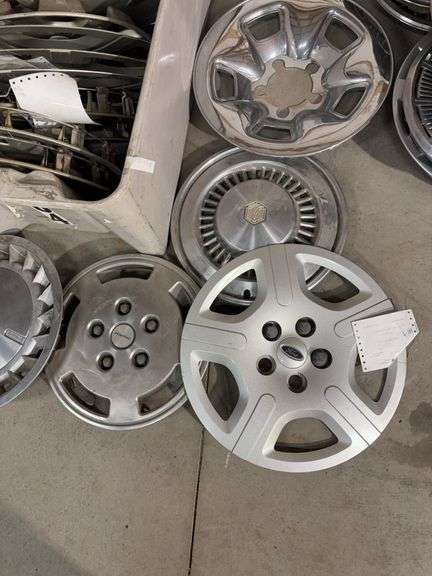 Large tote of hub caps and parts -Pontiac, Chrysler and more