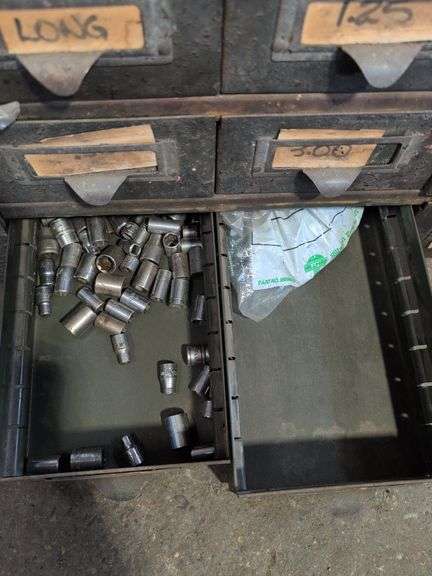 Metal hardware cabinet with nuts and bolts