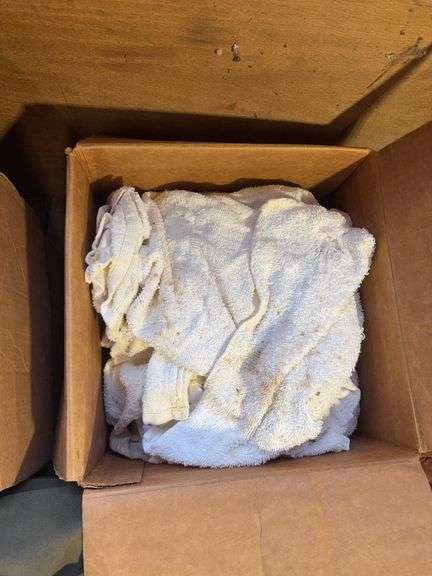 Boxes of rags, military bag, and blankets
